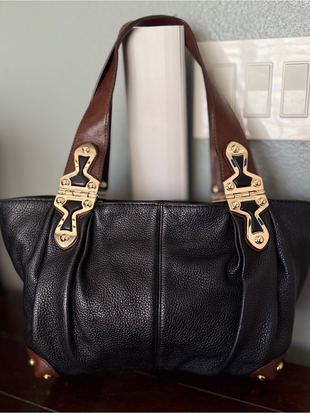 Michael Kors Black Leather Shoulder Bag with Brown Handles and Gold Hardware